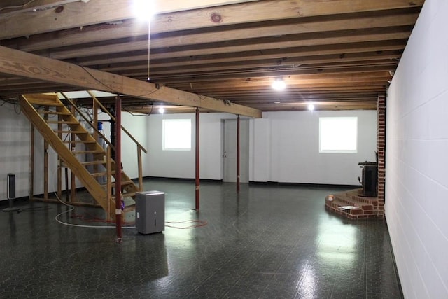 1722 Ball Ave, Dalton, GA 30720 - basement featuring a wood stove, stairway, and tile patterned floors