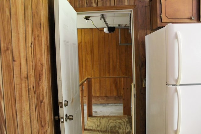 1722 Ball Ave, Dalton, GA 30720 - interior space with freestanding refrigerator, brown cabinets, and wood walls