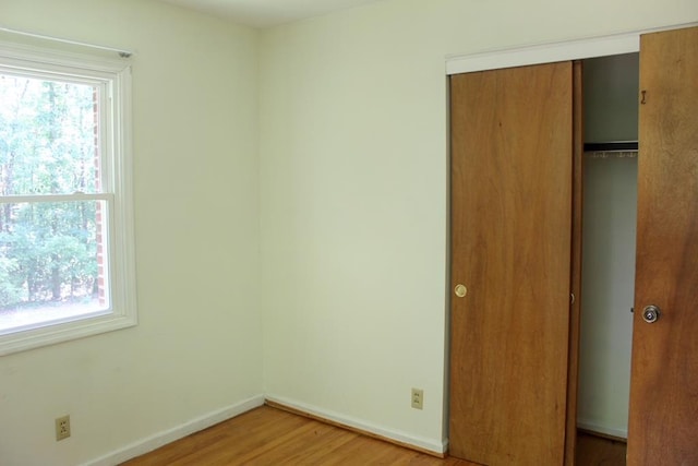 1722 Ball Ave, Dalton, GA 30720 - unfurnished bedroom with a closet, light wood finished floors, and baseboards