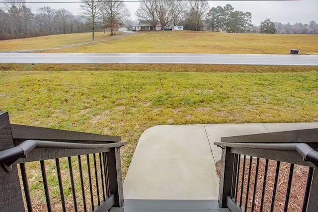 view of yard with a rural view