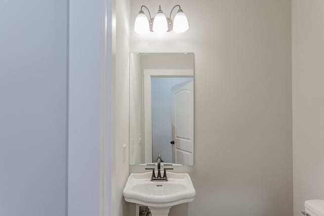 bathroom featuring sink and toilet