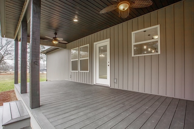 wooden deck featuring ceiling fan