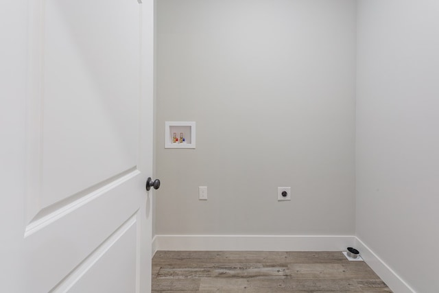 washroom featuring hardwood / wood-style floors, hookup for a washing machine, and hookup for an electric dryer