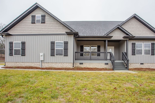 view of front of house with a porch and a front yard