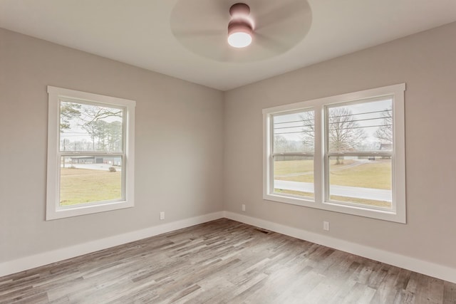 unfurnished room featuring ceiling fan and light wood-type flooring