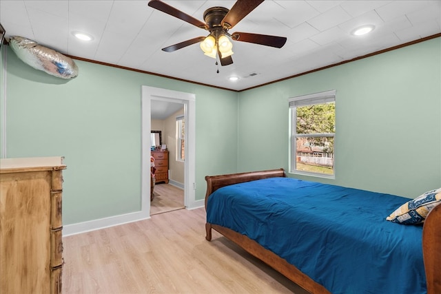 bedroom featuring visible vents, baseboards, ornamental molding, recessed lighting, and light wood-style flooring