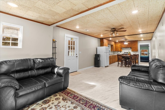 living room featuring a ceiling fan, recessed lighting, baseboards, and ornamental molding