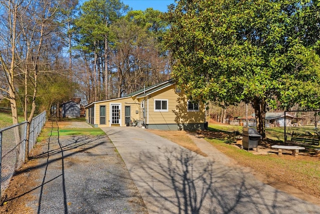 view of front of home featuring fence