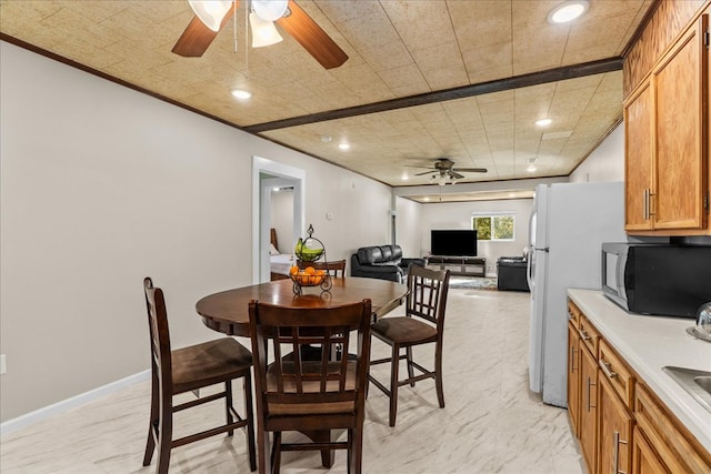 dining area with recessed lighting, a ceiling fan, baseboards, and ornamental molding