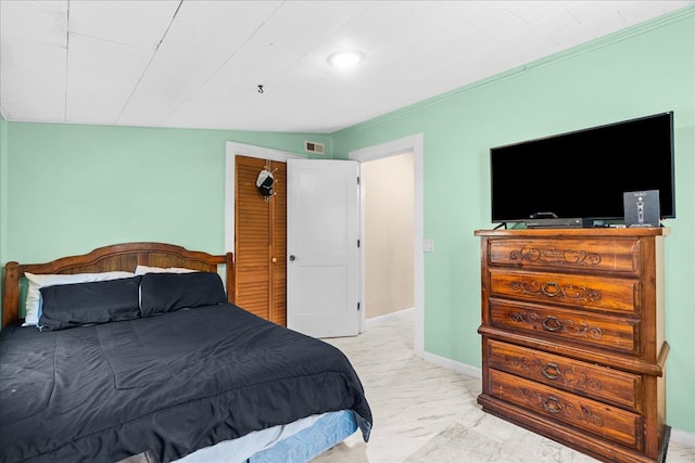 bedroom featuring visible vents and baseboards