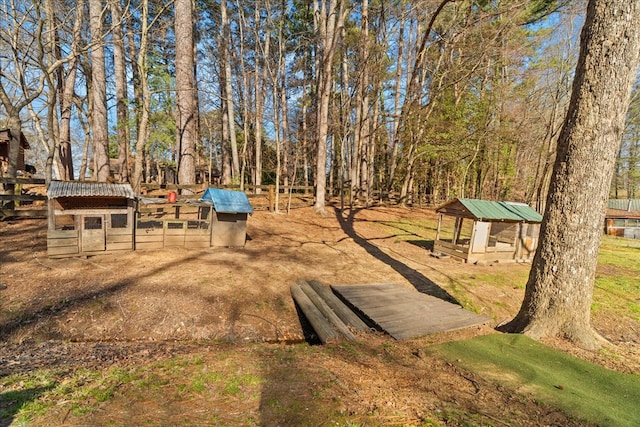 view of yard with an outdoor structure and exterior structure