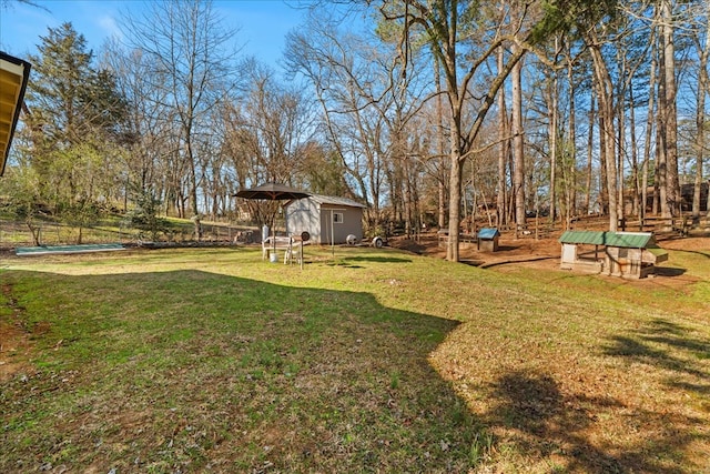 view of yard featuring an outbuilding and a storage shed