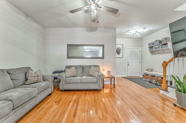 1521 Ashton Woods Way, Dalton, GA 30720 - living room with baseboards, stairway, a ceiling fan, and light wood finished floors