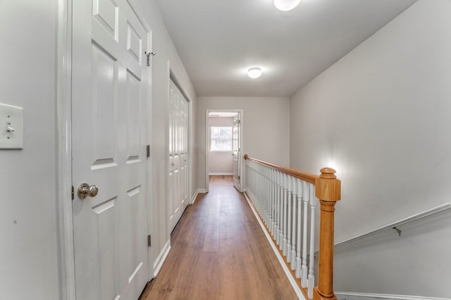 1521 Ashton Woods Way, Dalton, GA 30720 - hall featuring an upstairs landing, baseboards, and wood finished floors