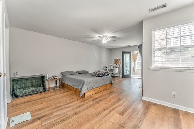 1521 Ashton Woods Way, Dalton, GA 30720 - bedroom with light wood-type flooring, baseboards, ceiling fan, and visible vents