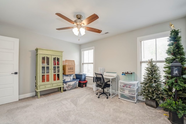 home office with light colored carpet and ceiling fan