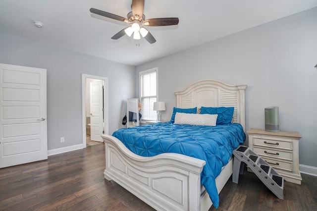 bedroom featuring ceiling fan, connected bathroom, and dark hardwood / wood-style flooring