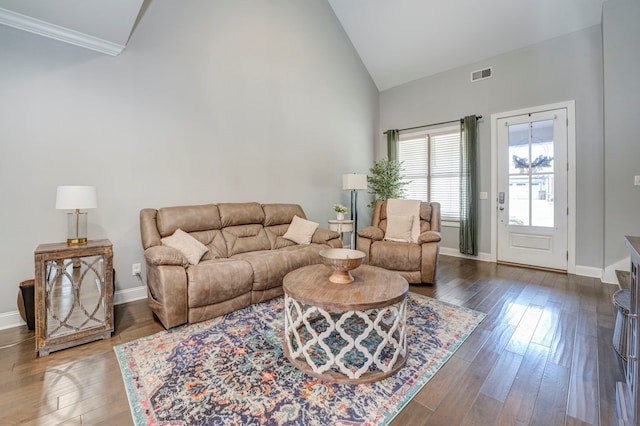 living room featuring dark hardwood / wood-style floors and high vaulted ceiling