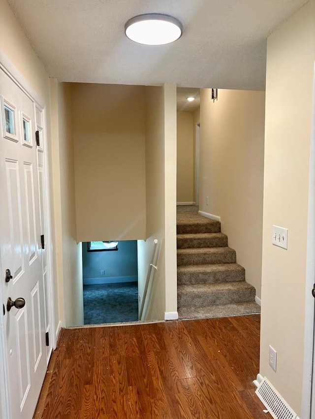 139 Hills Dr, Cohutta, GA 30710 - staircase with wood finished floors and baseboards