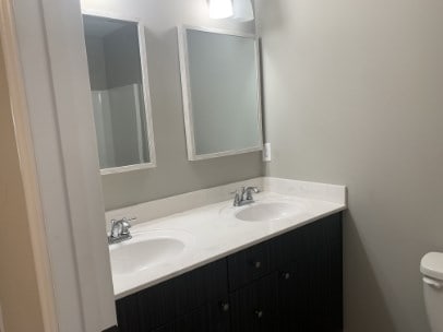 bathroom featuring vanity and toilet