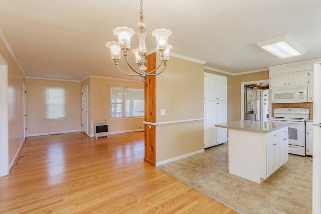 kitchen featuring a notable chandelier, a kitchen island, white appliances, light wood-style floors, and white cabinets