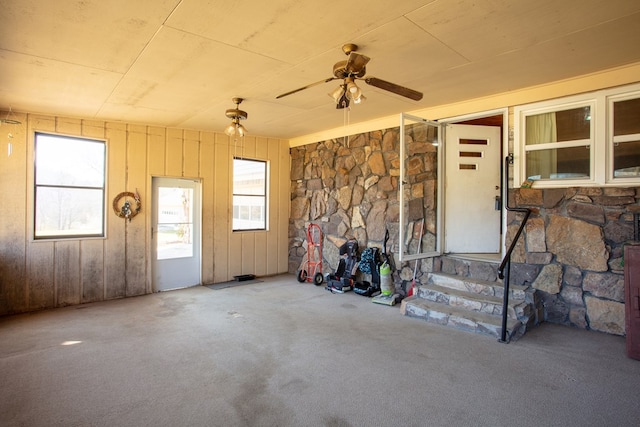 doorway to property with a ceiling fan and a patio area