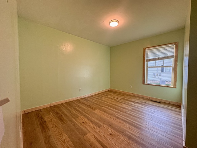 410 Anderson Ave, Dalton, GA 30721 - spare room featuring wood finished floors and baseboards