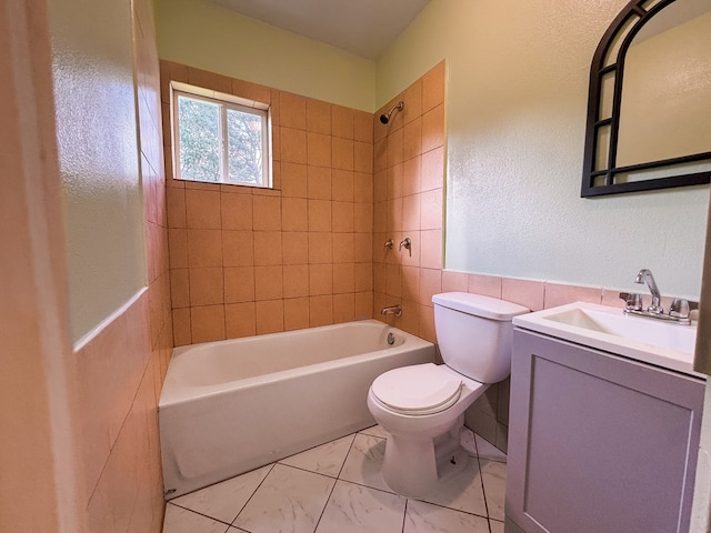 410 Anderson Ave, Dalton, GA 30721 - bathroom with vanity, shower / bathtub combination, and tile walls