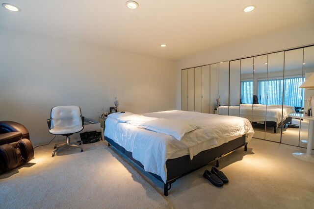 bedroom with light colored carpet