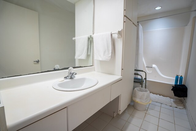 bathroom with vanity, tile patterned flooring, and shower / bathing tub combination