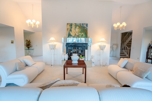 living room featuring an inviting chandelier, high vaulted ceiling, and light carpet