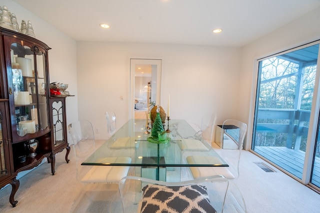 view of carpeted dining space