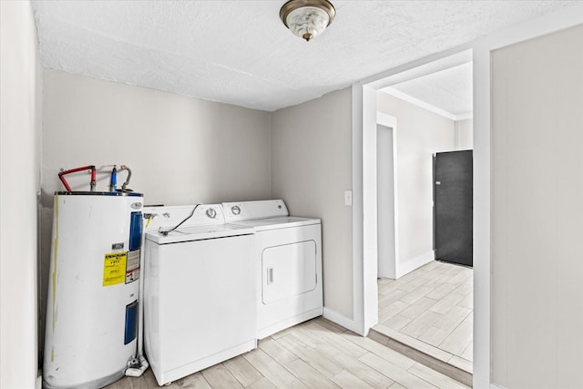 laundry room featuring laundry area, light wood-style flooring, water heater, a textured ceiling, and independent washer and dryer