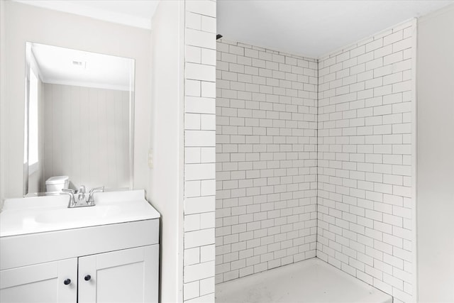 bathroom featuring a shower stall and vanity