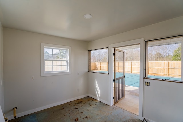 spare room featuring baseboards