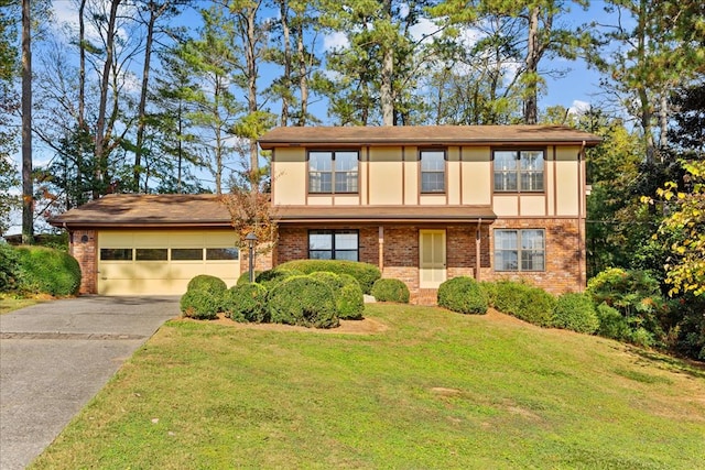 view of front of property with a garage and a front lawn