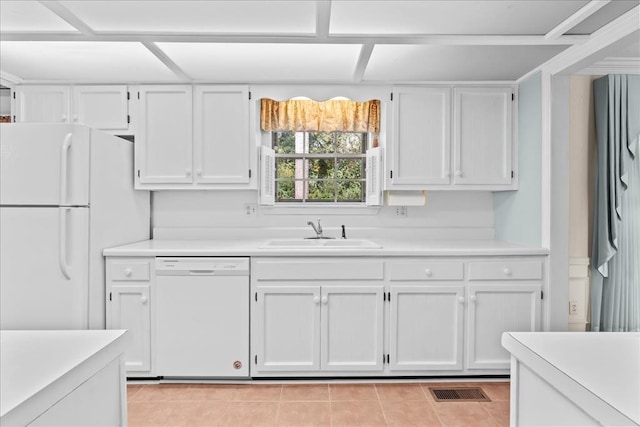 kitchen featuring sink, light tile patterned floors, white cabinets, and white appliances