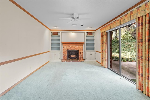 unfurnished living room featuring a brick fireplace, light colored carpet, built in features, and ornamental molding