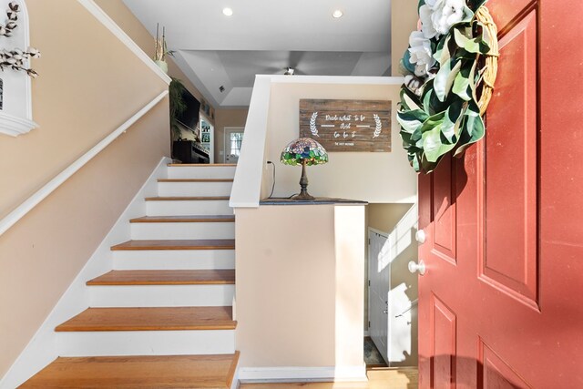 stairs featuring recessed lighting