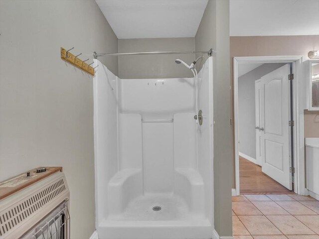 4978 Standifer Rd, Cohutta, GA 30710 - full bath featuring a shower, heating unit, tile patterned flooring, and baseboards