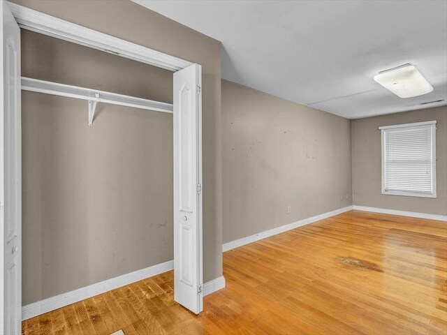 4978 Standifer Rd, Cohutta, GA 30710 - unfurnished bedroom featuring wood finished floors, baseboards, and a closet