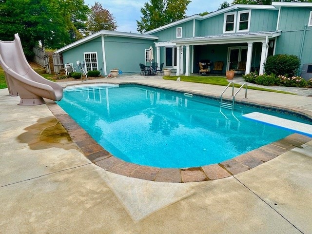 805 Waugh St, Dalton, GA 30720 - swimming pool featuring a water slide, a patio area, and a diving board