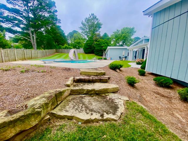 805 Waugh St, Dalton, GA 30720 - fenced yard with a patio