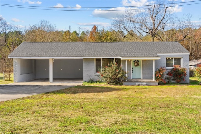 ranch-style house with a front yard and a carport