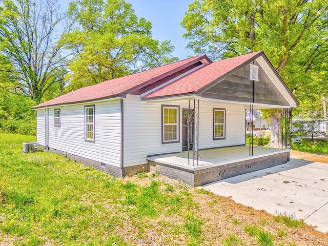 210 Grimes St, Dalton, GA 30721 - view of front of home featuring roof with shingles, covered porch, cooling unit, and crawl space