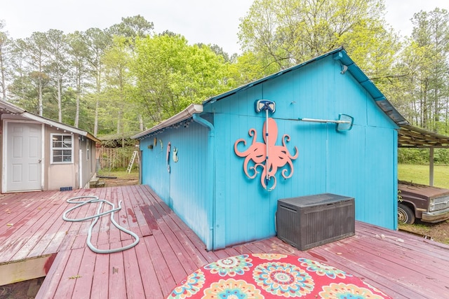 wooden deck featuring an outdoor structure
