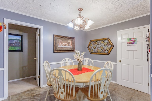dining room with ornamental molding, a notable chandelier, and a textured ceiling