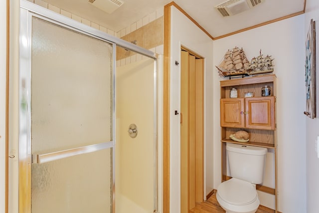 full bathroom featuring wood finished floors, visible vents, a shower stall, and toilet