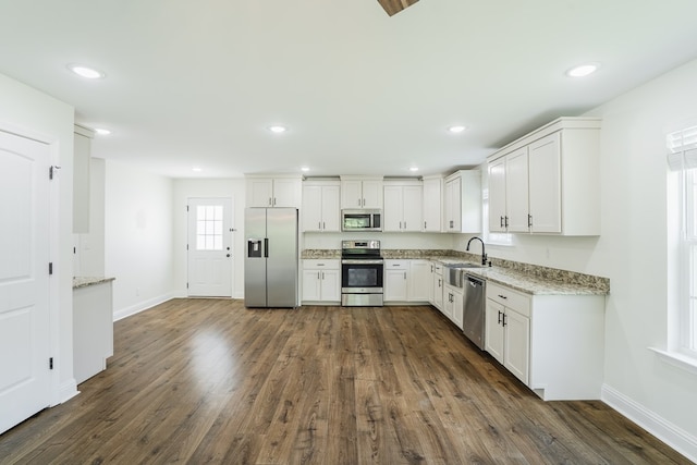 111 Arthur St, Dalton, GA 30721 - kitchen featuring appliances with stainless steel finishes, a sink, white cabinets, baseboards, and recessed lighting