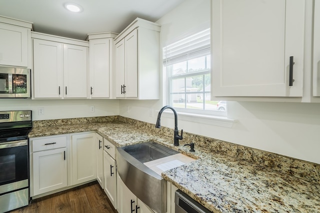 111 Arthur St, Dalton, GA 30721 - kitchen with appliances with stainless steel finishes, a sink, light stone countertops, white cabinetry, and recessed lighting